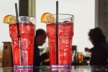 Baltimore, Maryland, USA Pink lemonade and straws in a restaurant. - obrazy, fototapety, plakaty