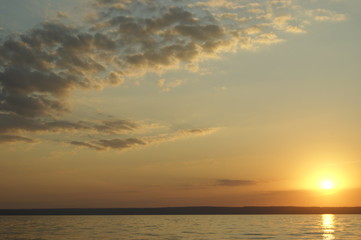 Gradient cloudy sunset off the coast of the great Russian river