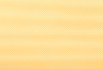 Fine grain yellow fabric. Texture background. Light yellow matte background of suede fabric