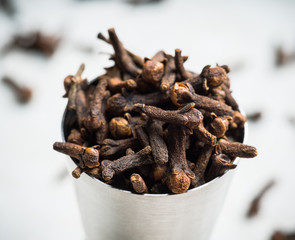 Dry cloves spices on the dark rustic background. Selective focus. shallow depth of field.