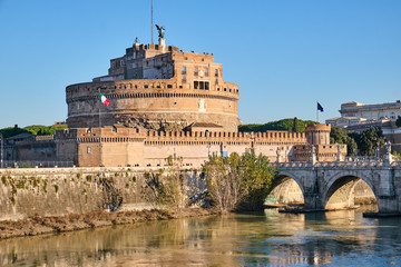 The Castel Sant Angelo and the Sant Angelo bridge in Rome on a sunny day - obrazy, fototapety, plakaty