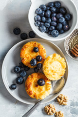 Cottage cheese pancakes with blueberries and honey.