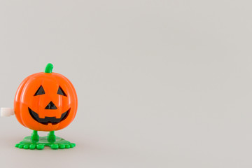 Halloween orange pumpkin on grey background