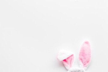 Easter bunny's ears on white background top-down copy space