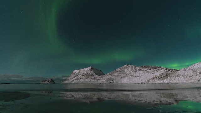 Timelapse of the Northern Lights above mountains in Norway