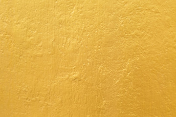 Gold paint on cement wall texture
