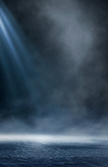 Wet asphalt, reflection of neon lights, a searchlight, smoke. Abstract light in a dark empty street with smoke, smog. Dark background scene of empty street, night view, night city.