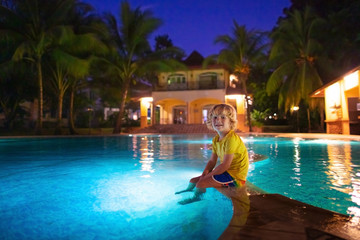 Kids in swimming pool at night