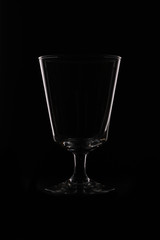 wine glass as idea and concept lighting and black background.