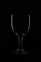 wine glass as idea and concept lighting and black background.