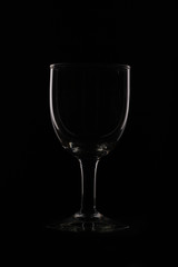 wine glass as idea and concept lighting and black background.