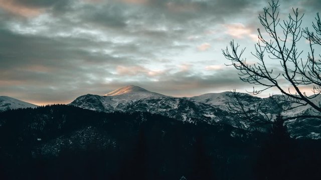 Timelapse of a sunrise light cast konto mountains in Tatra Region, Poland