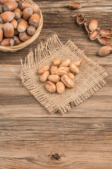 fresh hazelnuts on a wooden table with copy space