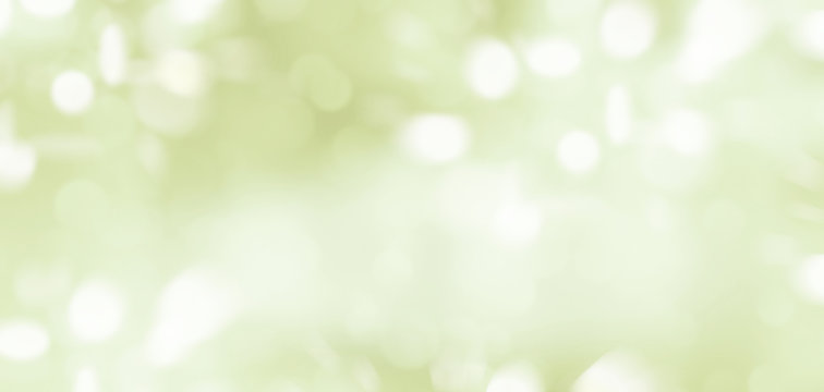 Abstract illustration of blurred light spots on light green background