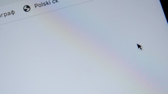 Online shopping. Close up of mouse clicking on Shopping Cart Icon on Screen