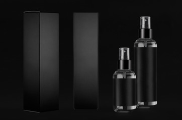 Black mock up for design of packing  cosmetics product - group transparent spray bottles, paper boxes of different sides, dark background.