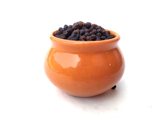 Black pepper peas put in a blue bowl isolated on white background