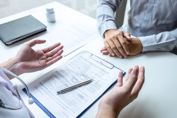 Doctor having conversation with patient while discussing explaining symptoms or counsel diagnosis health and consult treatment of disease, healthcare and assistance concept