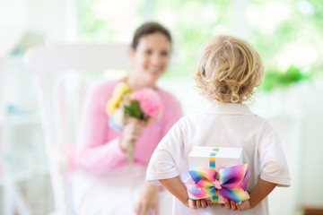 Obraz na płótnie Canvas Happy mother’s day. Child with present for mom.