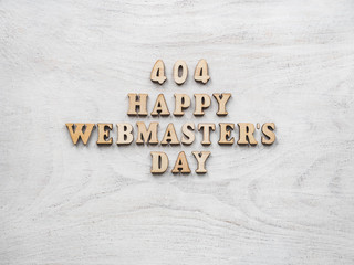Webmaster Day greeting card. Isolated background, close-up, view from above, wooden surface....