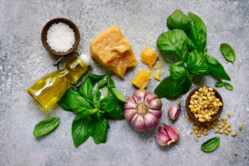 Food background with fresh ingredients for making basil pesto. Top view with copy space.