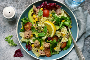 Pasta salad with tuna and vegetables. Top view with copy space.