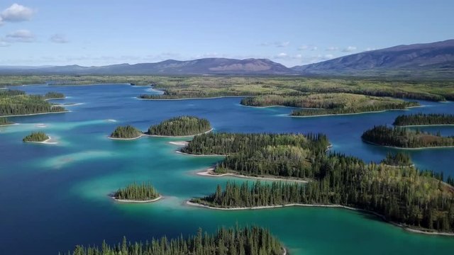 Amazing Caribbean-like Crystal Blue Waters Surrounding The Lush Islands In Boya Lake In BC, Canada - Wide Shot