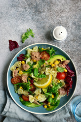 Pasta salad with tuna and vegetables. Top view with copy space.