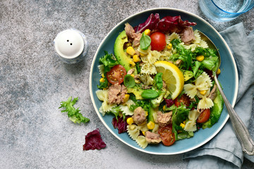 Pasta salad with tuna and vegetables. Top view with copy space.