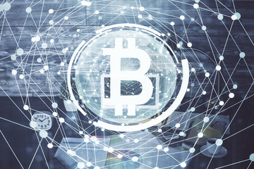 Double exposure of blockchain theme hologram and table with computer background. Concept of bitcoin crypto currency.