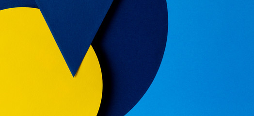 Abstract colored paper texture background. Minimal geometric shapes and lines in light blue, navy and yellow colors