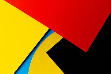 Abstract colored paper texture background. Minimal geometric shapes and lines in red, yellow,...