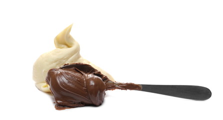 Chocolate and vanilla cream spread with metal spoon isolated on white background