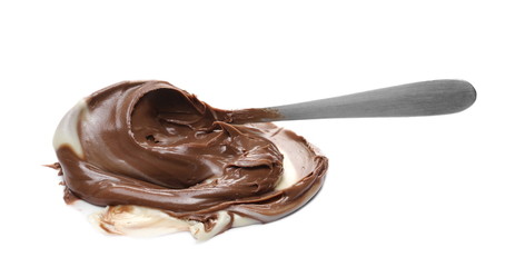 Chocolate and vanilla cream spread with metal spoon isolated on white background