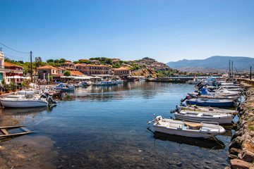Fototapeta na wymiar Marina with small motorized boats at the Molyvos harbor of Mithymna (Lesbos).