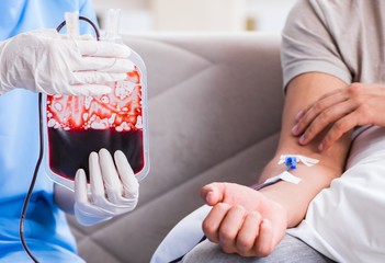 Patient getting blood transfusion in hospital clinic