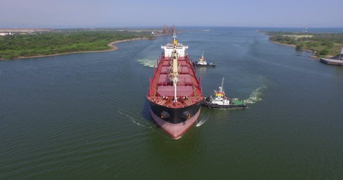 Aerial shot of a big ship being towed