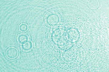 Fototapeta na wymiar texture of splashing clean water on turquoise background