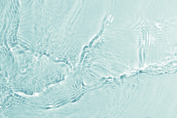 texture of splashing clean water on turquoise background