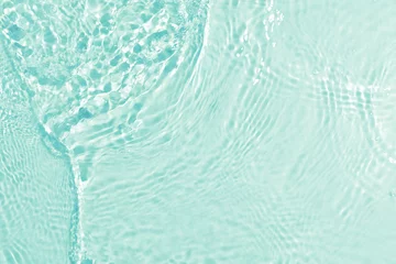 Fotobehang texture of splashing clean water on turquoise background © seksanwangjaisuk