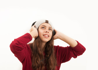 Fototapeta na wymiar Girl in headphones listens to music.