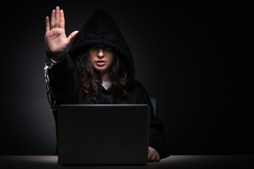 Female hacker hacking security firewall late in office