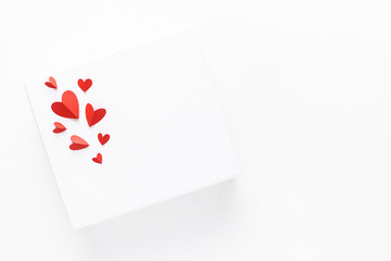 Valentine's day. Beautiful red paper hearts on a white surface. Top view.