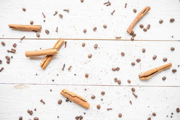 spices on a white wooden background. cinnamon and star anise on a white background