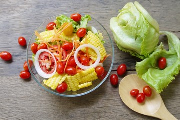 Bowl of  vegetable salad  on wooden table prepare for serving in the  kitchen, selective focus  . 