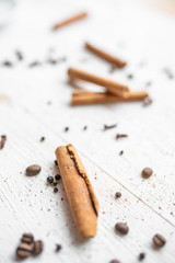 spices on a white wooden background. cinnamon and star anise on a white background