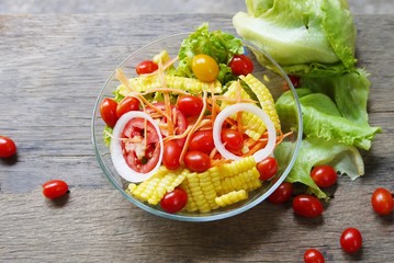 Bowl of  vegetable salad  on wooden table prepare for serving in the  kitchen, selective focus  . 