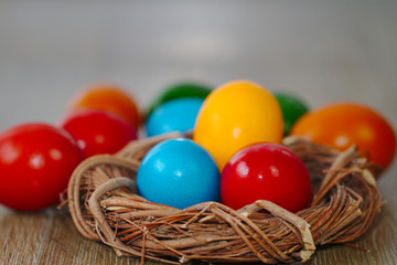 Small wicker nest with easter eggs