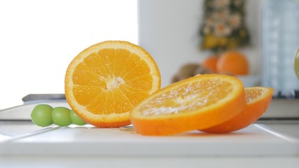Image with Orange Fruit Slices on the Kitchen Table, Sweet Organic and Healthy Tropical Fruitt