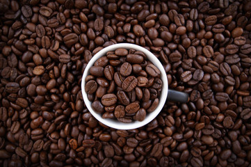 A cup filled with coffee grains.